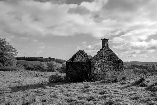 Walls but no roof on this deserted and derelict house in a Derbyshire field