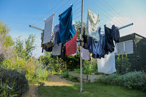 washed clothes hang on a string in the cold, hardened