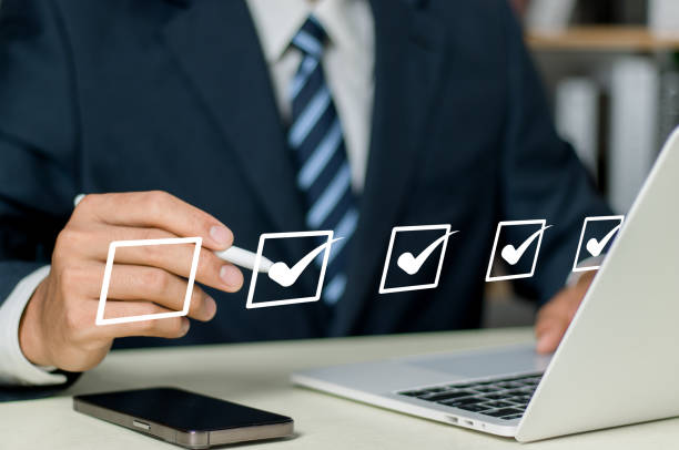istock Digital work checklist or electronic smart daily checklist concept. Check mark on virtual screen display for personal working in office Document Management System and process automation. 1807703007