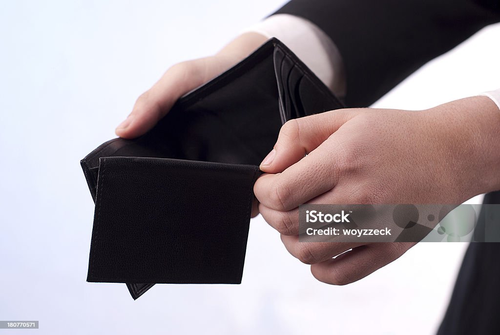 Empty wallet Man with an empty black wallet Adult Stock Photo
