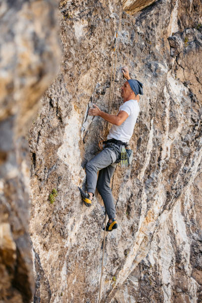 istock Mature Man Climbing The Mountain 1807713186