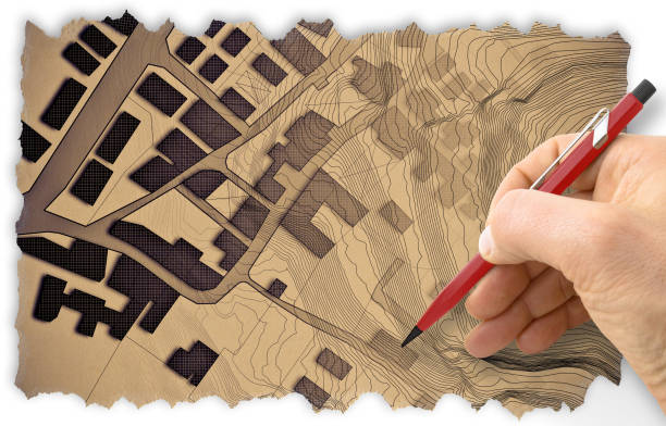 istock Engineer drawing a residential building over an imaginary cadastral map of territory with buildings, fields and roads - Retro style concept image with recycled cardboard with torn edges 1807717007