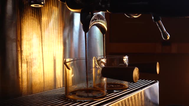 preparing coffee machine and brewing espresso coffee at small coffee shop