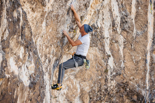 istock Mature Man Climbing The Mountain 1807723857