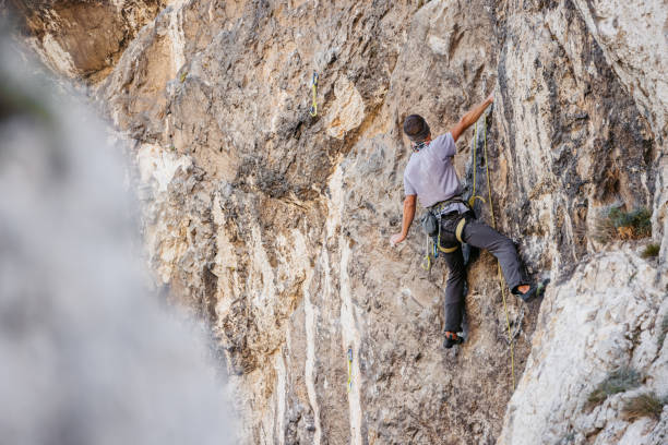 istock Young Man Climbing The Mountain 1807726544