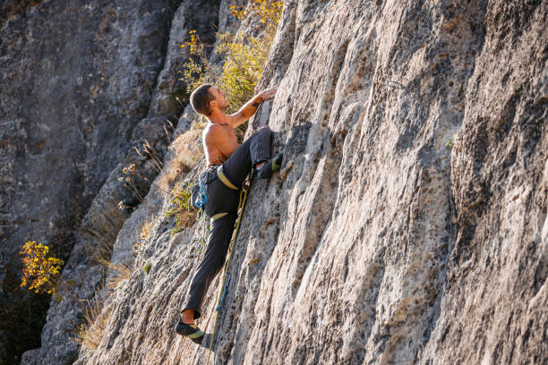 istock Young Man Climbing The Mountain 1807730287
