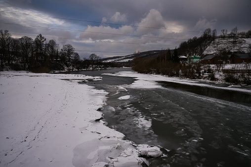 A half-frozen mountain river in the Ukrainian Carpathians.