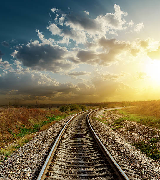 istock railroad goes to horizon in sunset 180773916