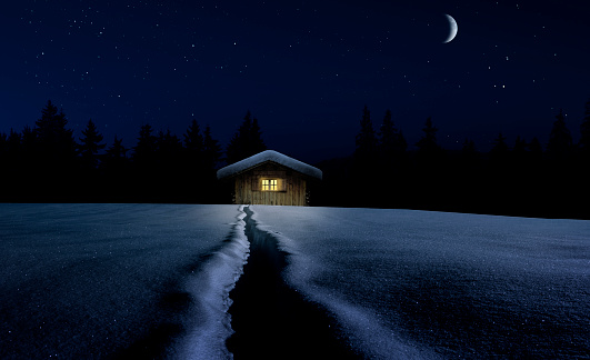Snow-covered winter hut on a starry night