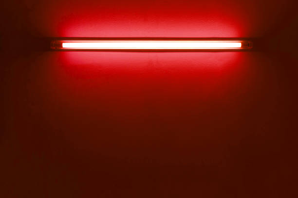 istock red neon bulbs on white wall. Background texture of empty old wall with glowing red neon bulbs. 1807743626