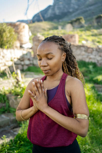istock Young woman meditating while doing yoga outdoors in nature 1807745780