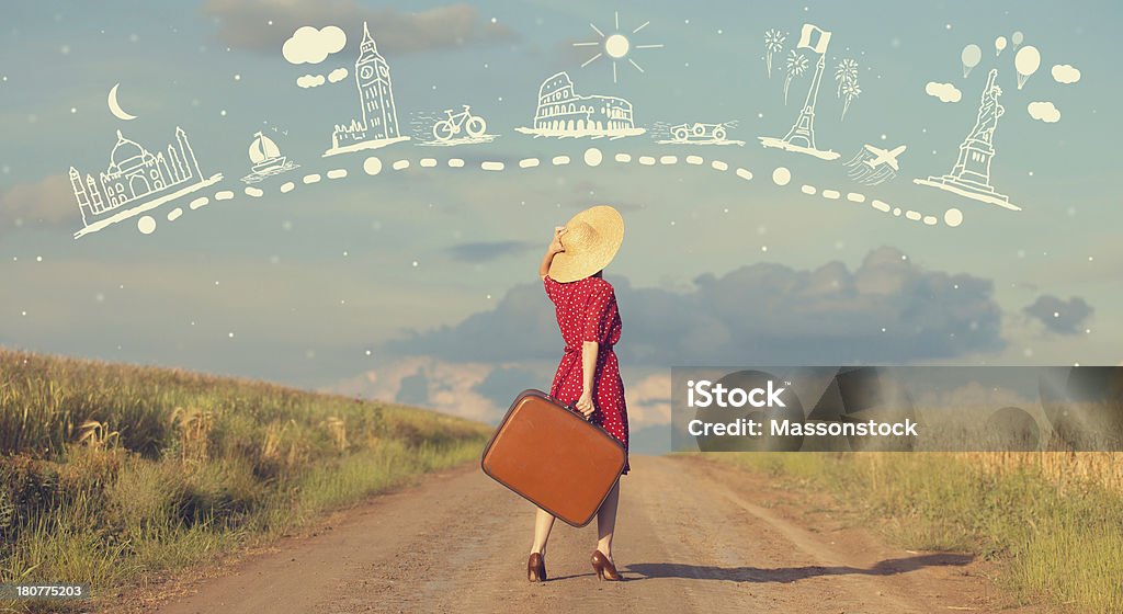Redhead girl with suitcase at outdoor. One Woman Only Stock Photo
