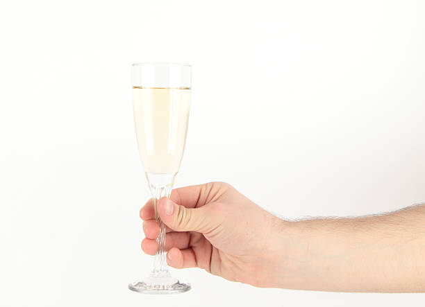 istock Hand holding glass of champagne 180776037