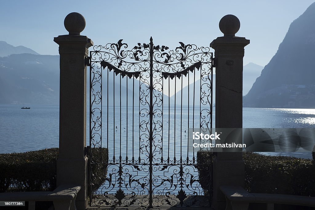 Gate Gate on the lakefront with mountain in park ciani in lugano switzerland Ticino Canton Stock Photo