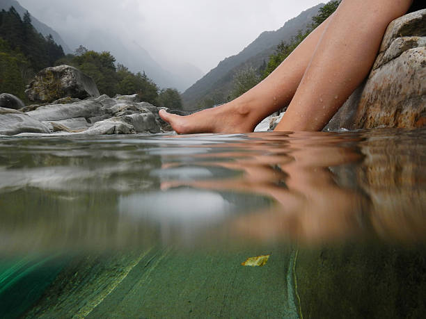 Feet on the water stock photo