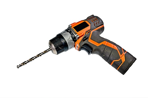 Used Electric Drill with Orange Trim on a white background