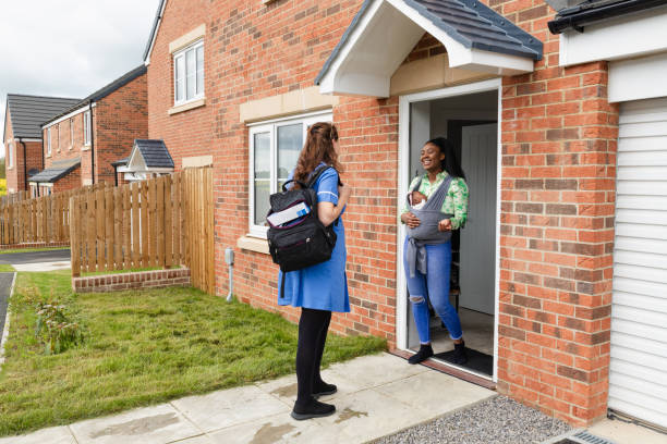 istock Nurse Visiting a Mother at Home 1807780837