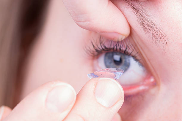istock Woman holds a Contact Lens 180778807
