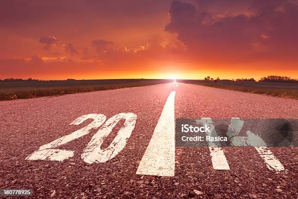 Driving On Empty Road Towards The Setting Sun 2014 Stock Photo - Download Image Now