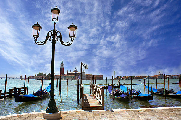 istock Gondolas moored by Saint Mark square, Venice, Italy 180779590