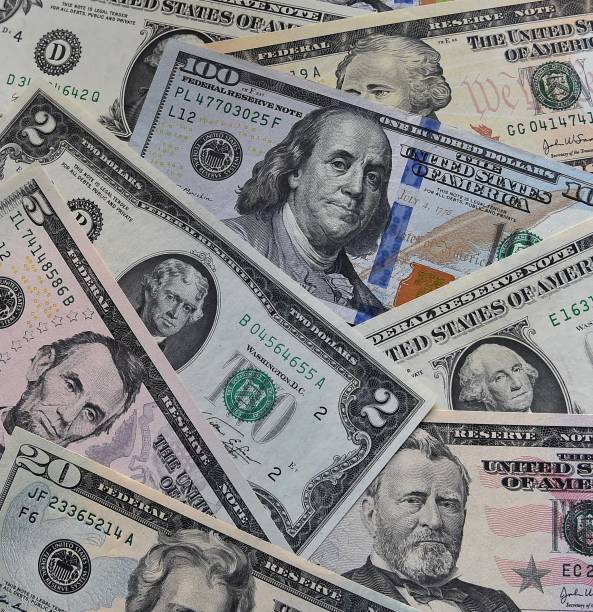 istock a few United States dollars in some current bank notes 1807800175