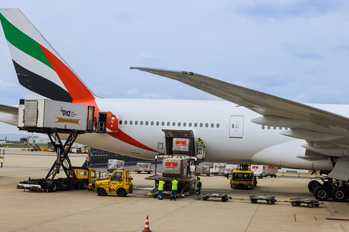 27 April 2023 Austria, VIE Vienna Loading operations plane Emirates with baggage at terminal Vienna Airport in Austria