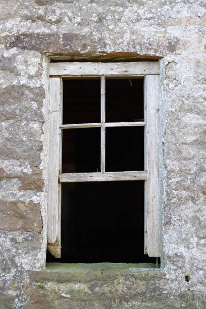 istock Looking through the window of an abandoned farmhouse 1807809977
