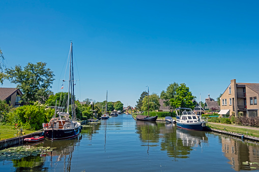 View on a canal in the historical city Workum in Friesland the Netherlands