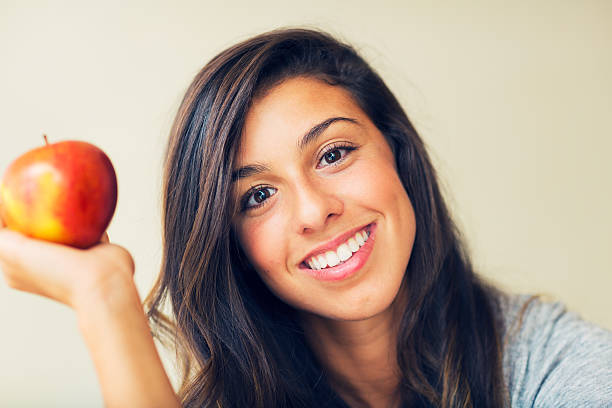 istock Beautiful woman with an apple 180781532