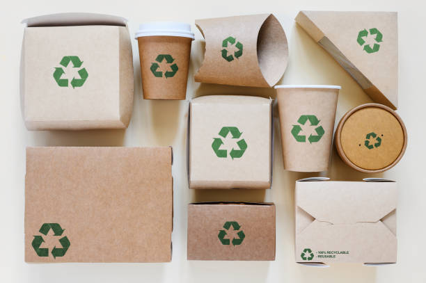 istock A set of evenly laid disposable tableware with recycling signs. Eco-friendly biodegradable tableware and paper packaging. View from above 1807816406