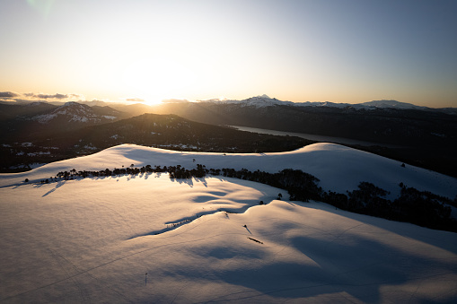 Sunset on the snowy mountains of the patagonian Andes in La Araucania region, southern Chile