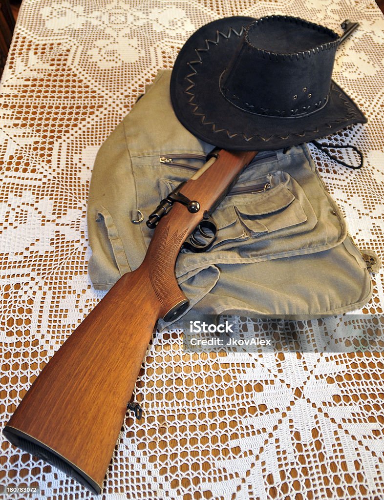 Hunting stories Showing hunting equipment as a symbol of hunting, hunting stories and experiences. Equipment was taken on my kitchen table, whose embroidery is the work of my mother's creativity. Camouflage Stock Photo