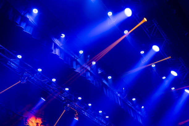 istock Light from stage lighting equipment in a concert hall 1807835543