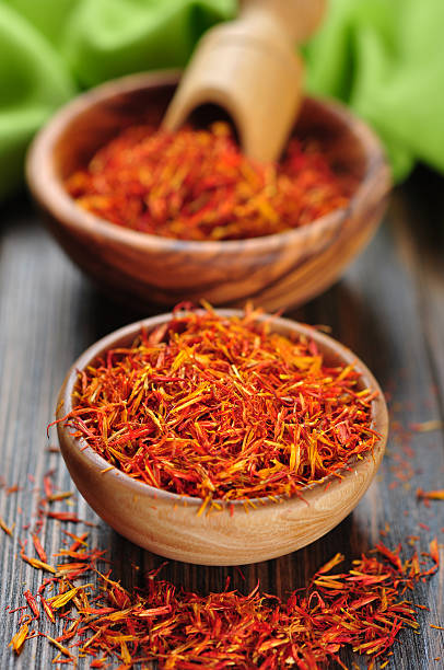 istock Saffron on wooden background 180784981