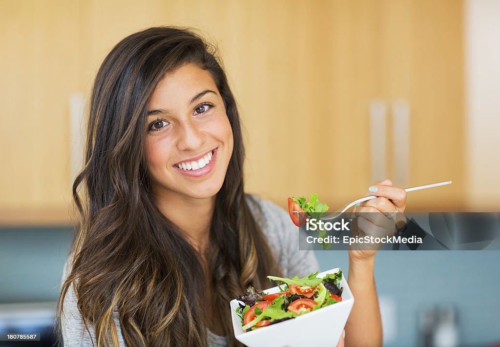 Healthy woman eating salad Beautiful healthy woman eating salad, Dieting Concept. Healthy Lifestyle. 20-24 Years Stock Photo