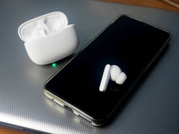 istock white earbuds and smart phone connect together 1807887000