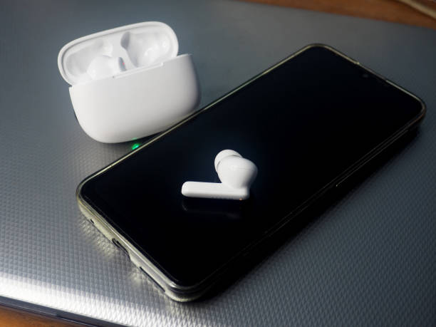 istock white earbuds and smart phone connect together 1807887552