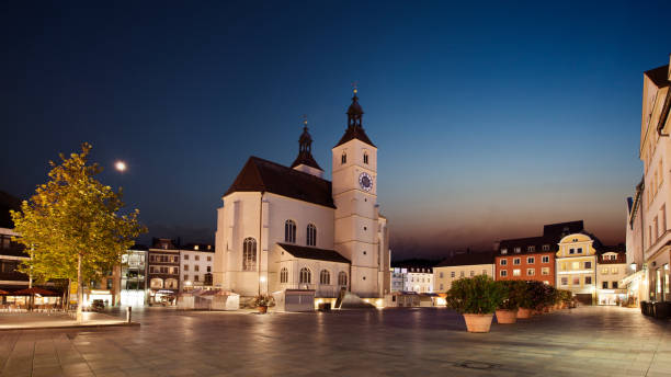 istock Panorama Neupfarrplatz in Regensburg with its Neupfarrkirche at blue hour 1807924482