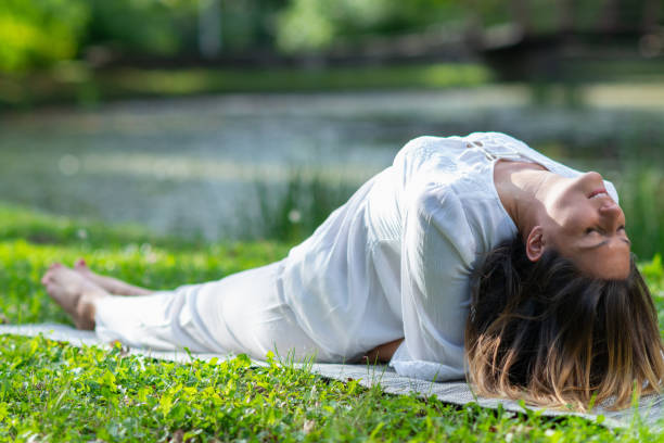 istock Woman gracefully practicing yoga, surrounded by natures peace and tranquility 1807935908