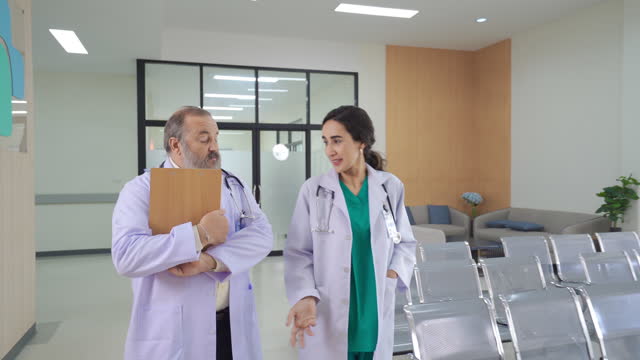 Two professor doctor talking and discuss in hospital.
