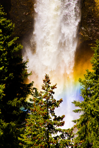 Rainbow seen thru a waterfall in the back