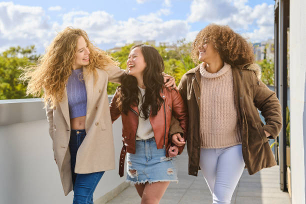 istock Multiethnic friendly women walking on terrace 1807939870