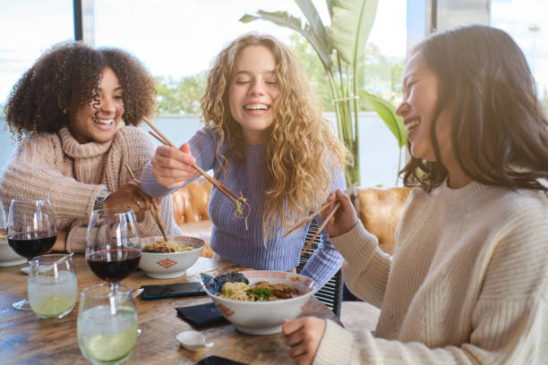 istock Group of diverse women having lunch in cafe 1807942023