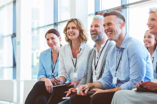 istock Group of excited people at business conference 1807981749