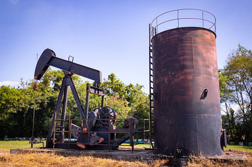 Classic machinery, levers being refined and rocked to make oil.