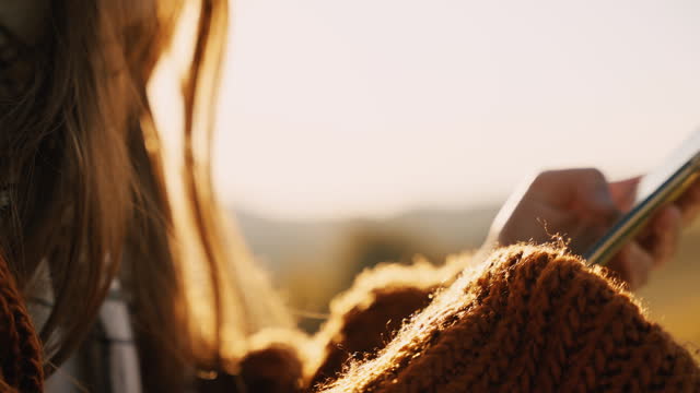 SLO MO Closeup of Woman Scrolling her Smartphone in Countryside on Sunny Day