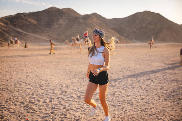 istock Young woman having fun in the desert while on vacation in Egypt 1808009623