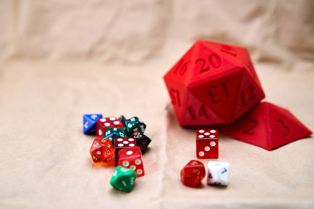 istock Diverse collection of colored dice on a cardboard surface 1808009650