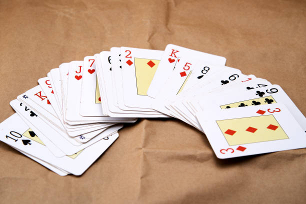 istock A deck of poker cards spread out on a table. 1808010169