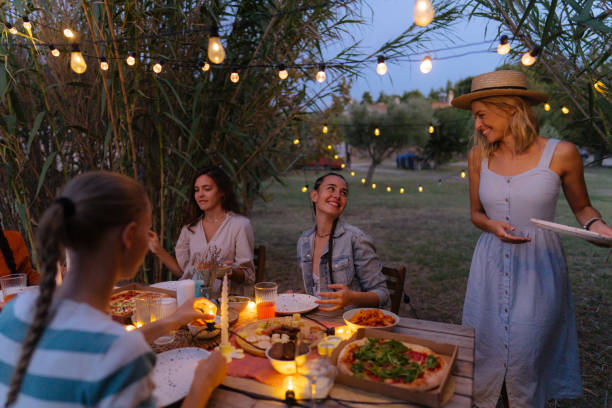 istock Female friends at the summer dinner party 1808015664